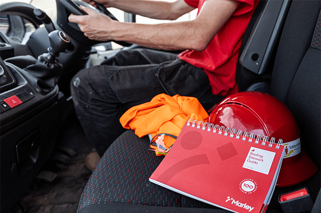 Marley roofing sitework guide on passenger seat in van